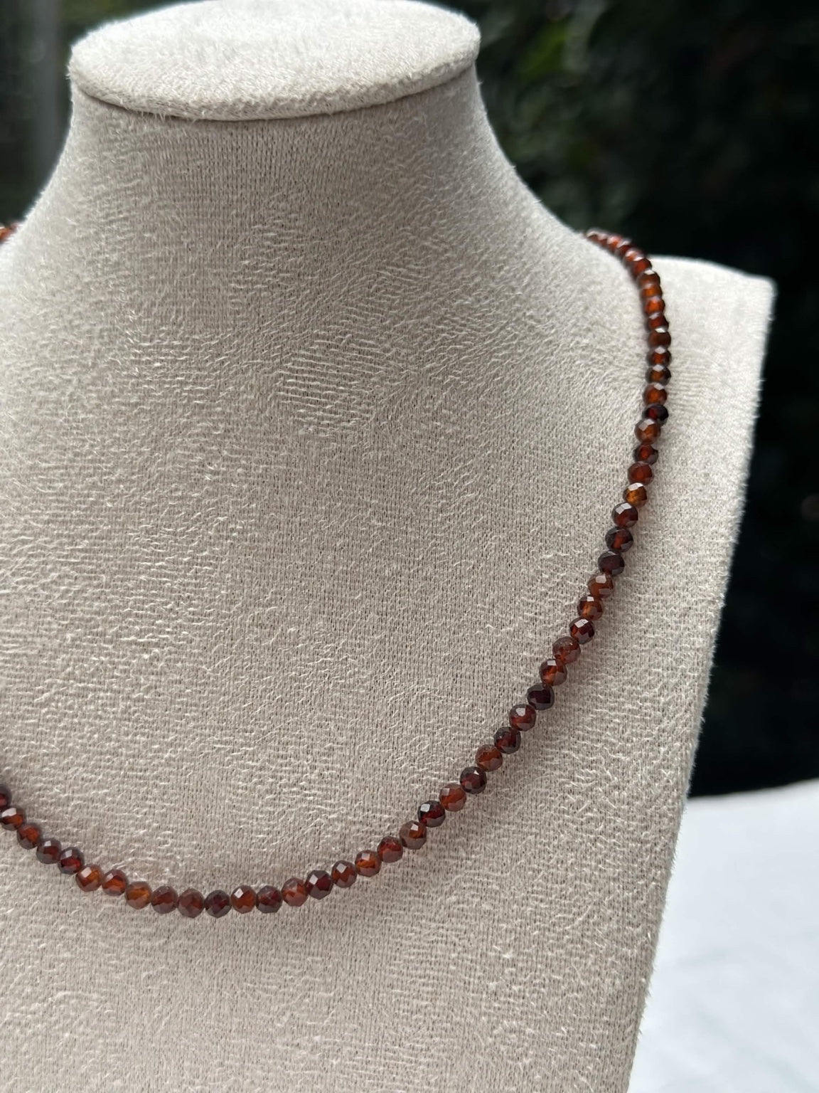 Close-up of burgundy faceted beads