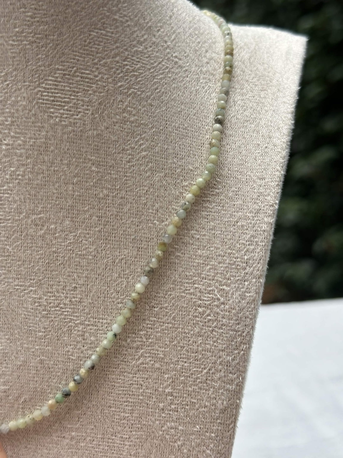 Close-up of pale green beads