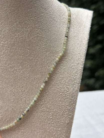 Close-up of pale green beads
